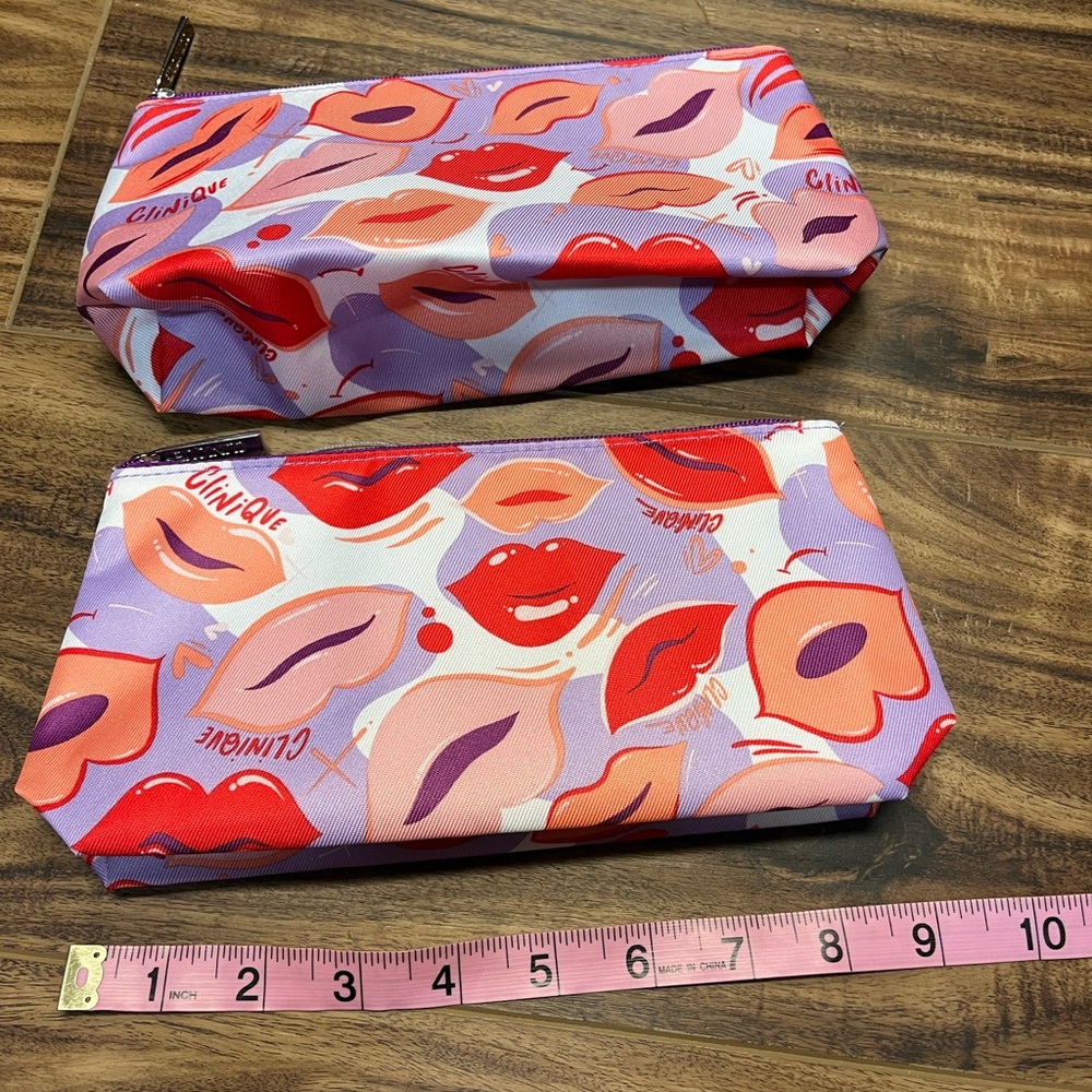 - Lot of two Clinique lips print makeup bags, NWOT